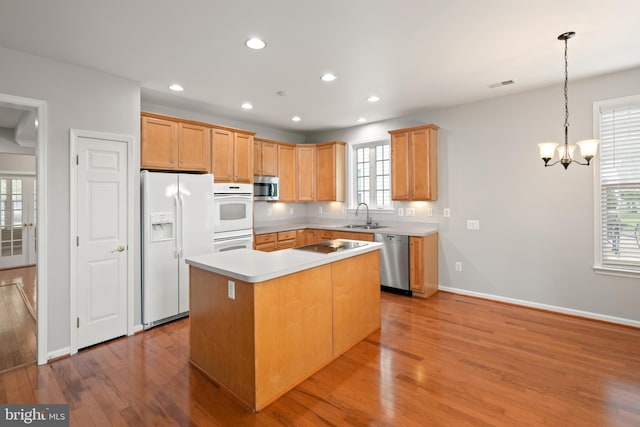 30 Amandas Teal Dr, Bridgeville, DE 19933 - kitchen with stainless steel appliances, a sink, a chandelier, light wood-type flooring, and recessed lighting