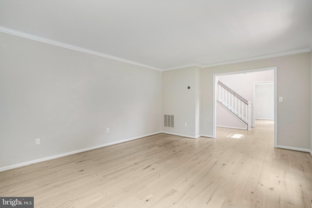 5926 Clermont Landing Ct, Burke, VA 22015 - unfurnished room with ornamental molding, baseboards, light wood-style flooring, and stairway