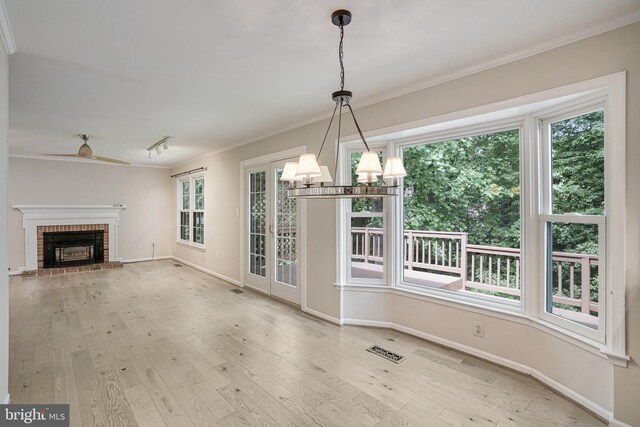5926 Clermont Landing Ct, Burke, VA 22015 - unfurnished dining area with crown molding, wood-type flooring, a chandelier, a ceiling fan, and baseboards