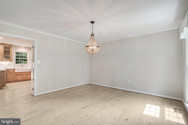 5926 Clermont Landing Ct, Burke, VA 22015 - empty room with light wood-type flooring, a sink, baseboards, and ornamental molding