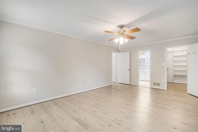 5926 Clermont Landing Ct, Burke, VA 22015 - empty room featuring a ceiling fan, ornamental molding, light wood finished floors, and baseboards