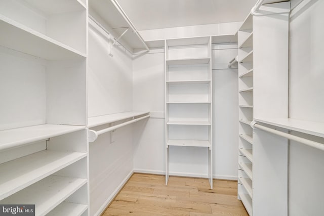 5926 Clermont Landing Ct, Burke, VA 22015 - spacious closet featuring light wood-style floors
