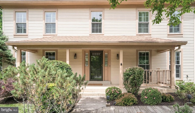 5926 Clermont Landing Ct, Burke, VA 22015 - view of front of property with covered porch and a shingled roof