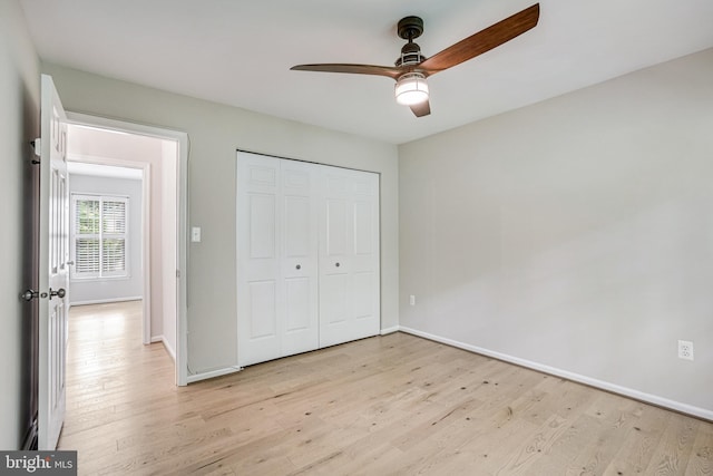 5926 Clermont Landing Ct, Burke, VA 22015 - unfurnished bedroom featuring light wood finished floors, baseboards, and a closet
