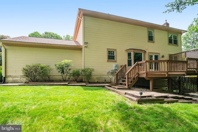 5926 Clermont Landing Ct, Burke, VA 22015 - rear view of property with a wooden deck, a lawn, and a chimney