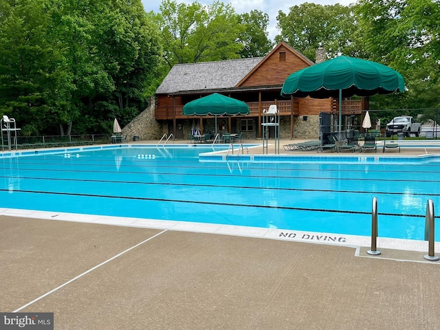 5926 Clermont Landing Ct, Burke, VA 22015 - community pool featuring view of scattered trees and a patio area