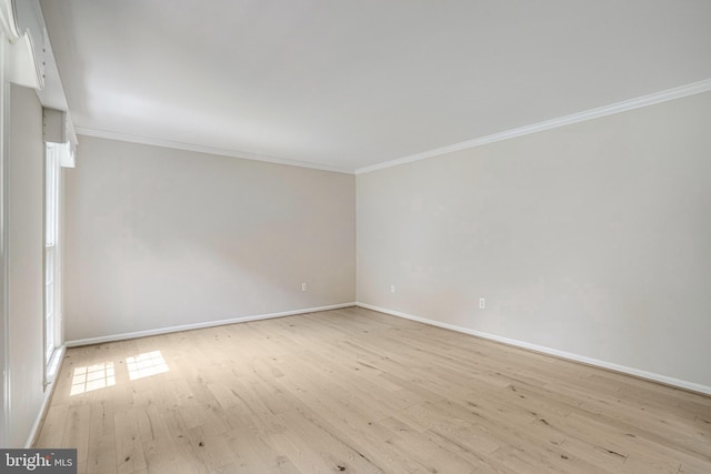 5926 Clermont Landing Ct, Burke, VA 22015 - empty room featuring baseboards, ornamental molding, and light wood-style floors