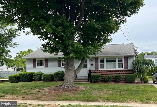 18 Jamaica Way, Hamilton, NJ 08610 - view of front facade featuring brick siding, a front lawn, and a shingled roof