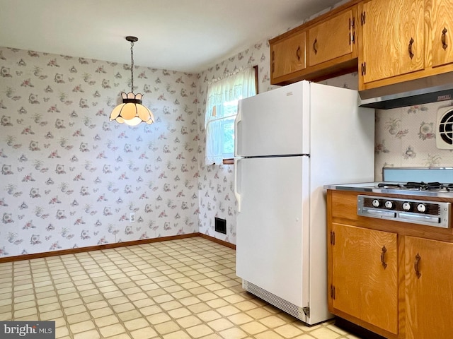 18 Jamaica Way, Hamilton, NJ 08610 - kitchen with wallpapered walls, freestanding refrigerator, brown cabinets, hanging light fixtures, and baseboards