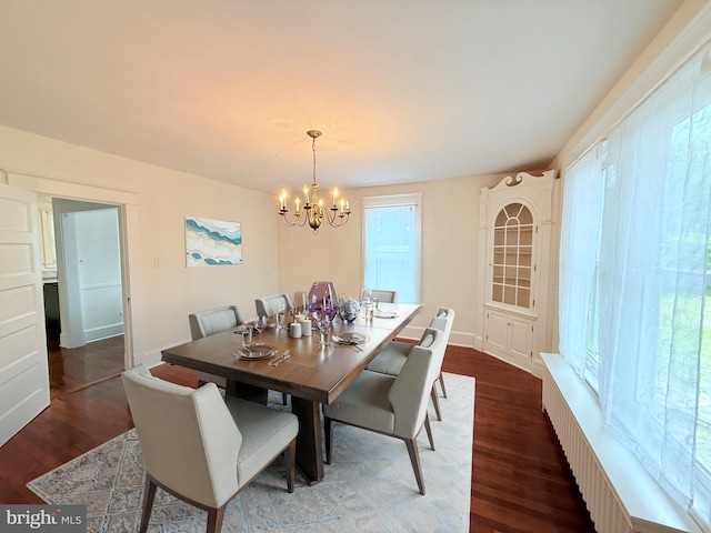 2806 Northumberland Hwy, Lottsburg, VA 22511 - dining area featuring a chandelier and dark wood-style floors