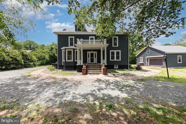 2806 Northumberland Hwy, Lottsburg, VA 22511 - view of front of house with a balcony, an outbuilding, a chimney, and covered porch