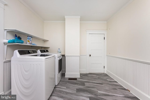 2806 Northumberland Hwy, Lottsburg, VA 22511 - clothes washing area featuring washing machine and clothes dryer, wainscoting, and crown molding