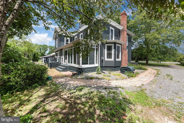 2806 Northumberland Hwy, Lottsburg, VA 22511 - view of side of property featuring a sunroom and a chimney