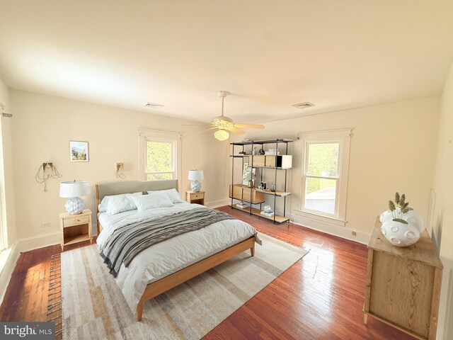 2806 Northumberland Hwy, Lottsburg, VA 22511 - bedroom with multiple windows, wood finished floors, baseboards, and a ceiling fan