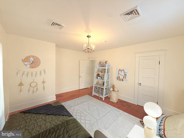 2806 Northumberland Hwy, Lottsburg, VA 22511 - bedroom featuring a chandelier, wood finished floors, and baseboards