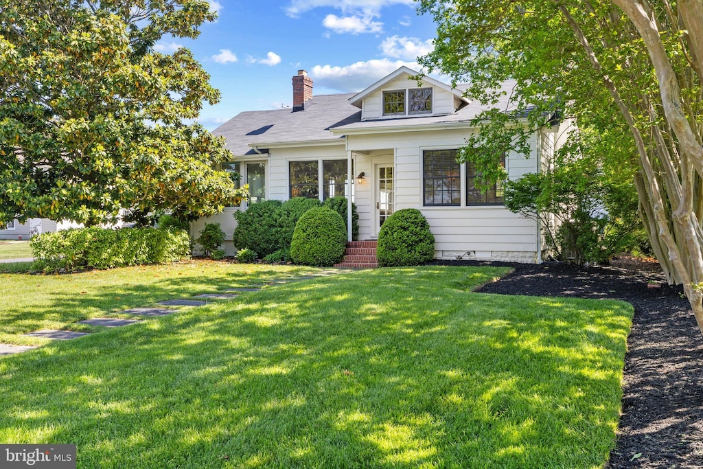 43 E Lake Dr, Annapolis, MD 21403 - bungalow-style house with a front yard and a chimney