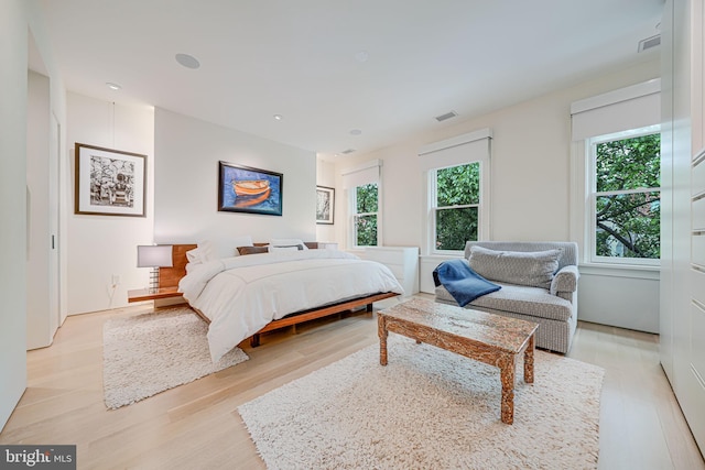 1448 Corcoran St NW, Washington, DC 20009 - bedroom featuring multiple windows, light wood-style floors, and recessed lighting