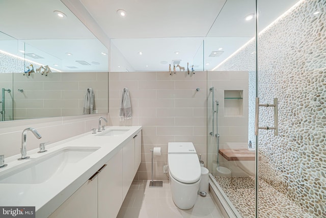 1448 Corcoran St NW, Washington, DC 20009 - full bathroom featuring tile walls, tile patterned flooring, double vanity, toilet, and a shower stall