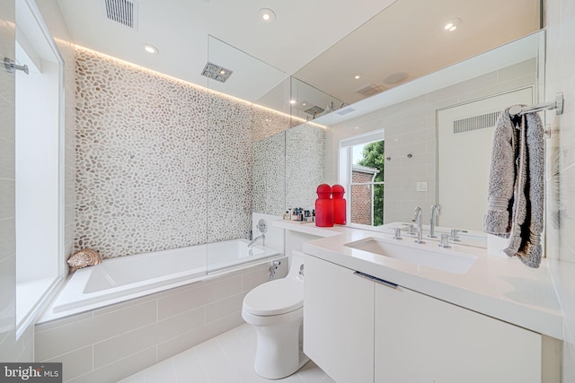 1448 Corcoran St NW, Washington, DC 20009 - bathroom featuring vanity, toilet, tiled shower / bath, tile patterned flooring, and recessed lighting