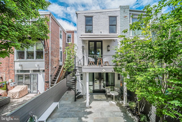 1448 Corcoran St NW, Washington, DC 20009 - rear view of house featuring stairs, a patio area, brick siding, and french doors