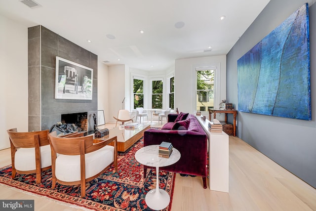 1448 Corcoran St NW, Washington, DC 20009 - living area featuring a large fireplace, wood finished floors, and recessed lighting