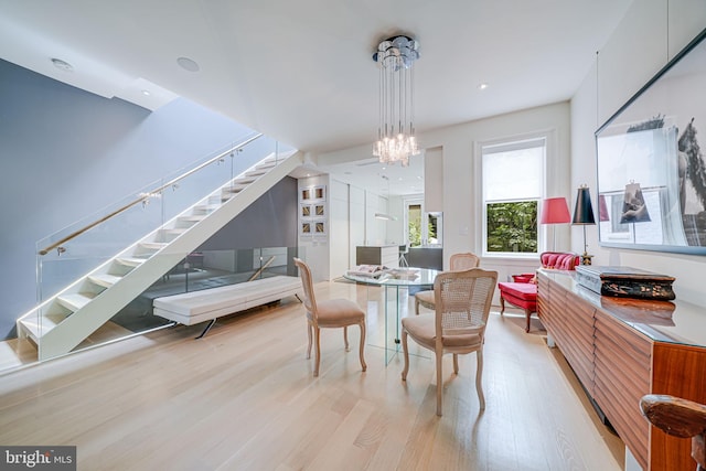 1448 Corcoran St NW, Washington, DC 20009 - dining space featuring wood finished floors, stairway, and a chandelier