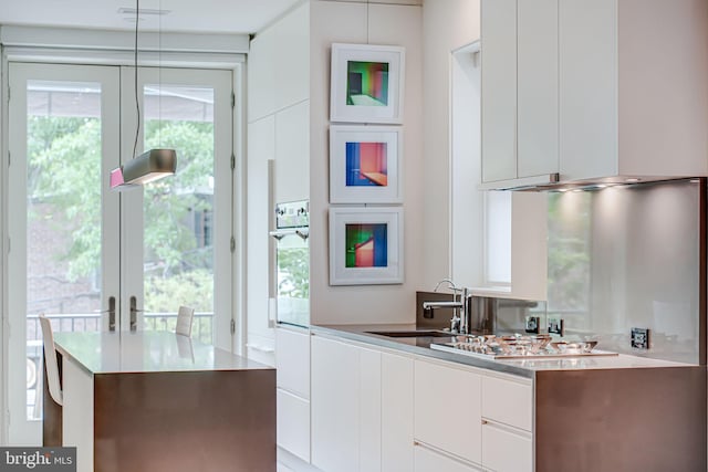 1448 Corcoran St NW, Washington, DC 20009 - kitchen featuring modern cabinets, a sink, stainless steel appliances, and white cabinets
