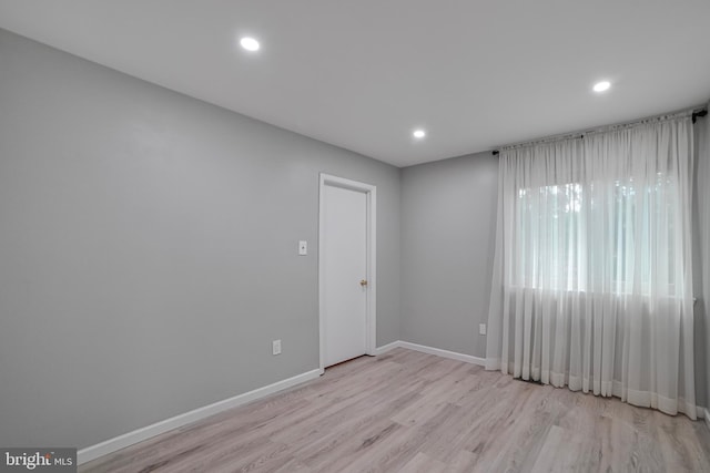 20138 Wynnfield Dr, Germantown, MD 20874 - empty room with light wood-style floors, baseboards, and recessed lighting