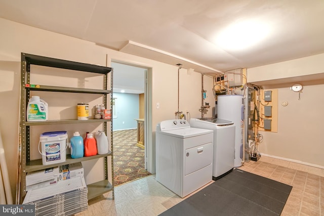 20138 Wynnfield Dr, Germantown, MD 20874 - washroom with water heater, washer and dryer, light flooring, and baseboards