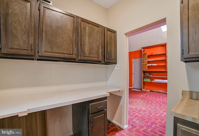 20138 Wynnfield Dr, Germantown, MD 20874 - kitchen with light countertops, dark colored carpet, and dark brown cabinets