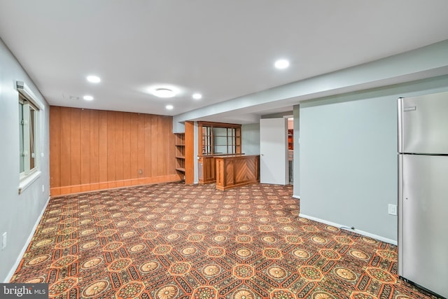 20138 Wynnfield Dr, Germantown, MD 20874 - finished basement with freestanding refrigerator, bar area, baseboards, wooden walls, and recessed lighting