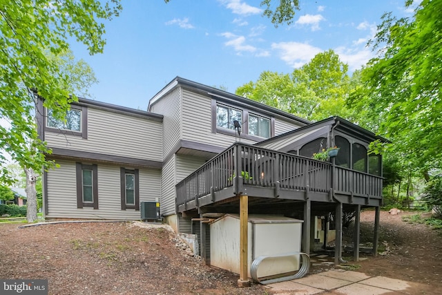 20138 Wynnfield Dr, Germantown, MD 20874 - rear view of house featuring a wooden deck, a sunroom, and central AC unit