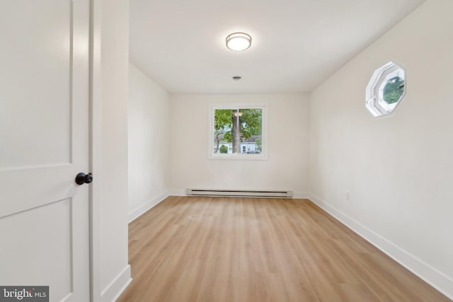 818 Dale Rd, Glen Burnie, MD 21060 - empty room with a baseboard heating unit, wood finished floors, and baseboards