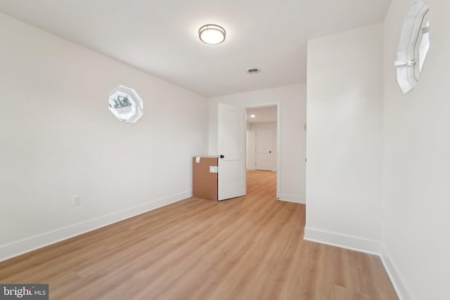 818 Dale Rd, Glen Burnie, MD 21060 - spare room with baseboards and light wood finished floors