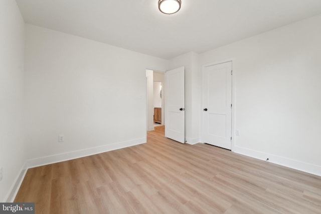 818 Dale Rd, Glen Burnie, MD 21060 - unfurnished bedroom featuring light wood-type flooring, baseboards, and a closet