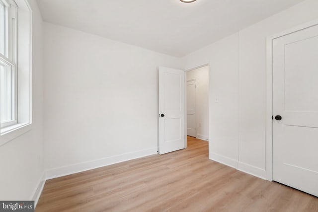 818 Dale Rd, Glen Burnie, MD 21060 - unfurnished bedroom with light wood-style floors and baseboards