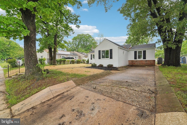 818 Dale Rd, Glen Burnie, MD 21060 - ranch-style house with driveway, brick siding, and central AC unit
