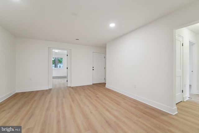 818 Dale Rd, Glen Burnie, MD 21060 - spare room with light wood-type flooring, baseboards, recessed lighting, and baseboard heating