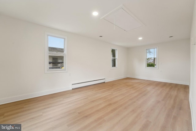 818 Dale Rd, Glen Burnie, MD 21060 - unfurnished room featuring a baseboard heating unit, attic access, recessed lighting, light wood-style floors, and baseboards
