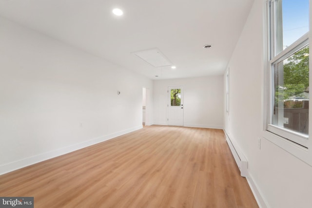 818 Dale Rd, Glen Burnie, MD 21060 - unfurnished room featuring attic access, a baseboard radiator, light wood finished floors, recessed lighting, and baseboards