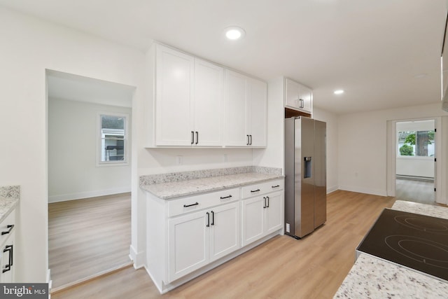 818 Dale Rd, Glen Burnie, MD 21060 - kitchen featuring stainless steel fridge, white cabinets, light wood-style floors, baseboards, and recessed lighting