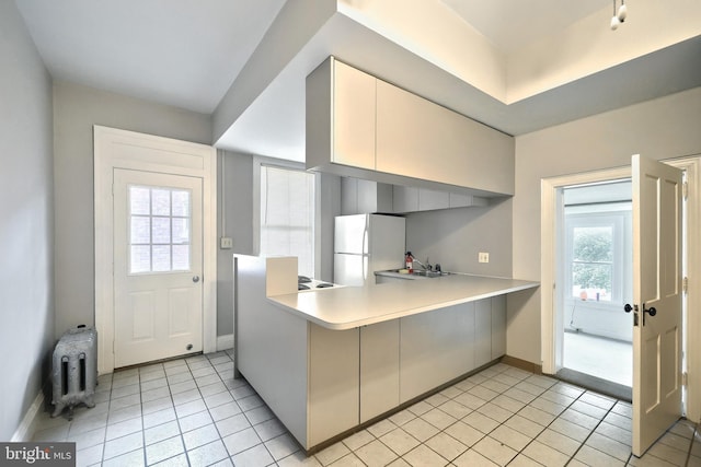 476 W Market St, York, PA 17401 - kitchen with freestanding refrigerator, light countertops, light tile patterned floors, and baseboards