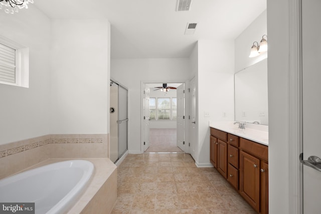 54 Ruddy Duck Ln, Bridgeville, DE 19933 - bathroom featuring vanity, a garden tub, ceiling fan, a shower stall, and tile patterned flooring