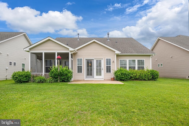 54 Ruddy Duck Ln, Bridgeville, DE 19933 - rear view of property with a patio area, a sunroom, a yard, and roof with shingles
