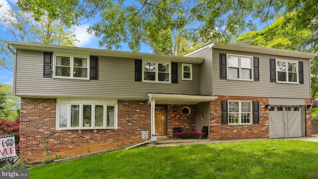 141 N Woodbine Ave, Langhorne, PA 19047 - view of front facade with brick siding, a garage, a front lawn, and driveway