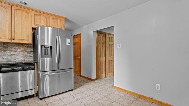 141 N Woodbine Ave, Langhorne, PA 19047 - kitchen with appliances with stainless steel finishes, baseboards, tasteful backsplash, and light brown cabinets