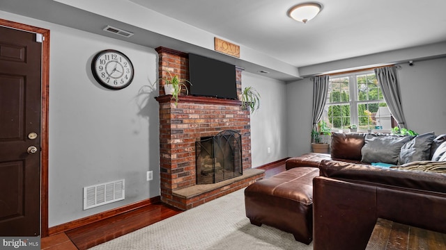141 N Woodbine Ave, Langhorne, PA 19047 - living area featuring a fireplace, baseboards, and wood finished floors