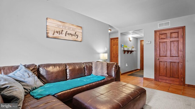 141 N Woodbine Ave, Langhorne, PA 19047 - living room featuring tile patterned floors and baseboards