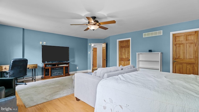 141 N Woodbine Ave, Langhorne, PA 19047 - bedroom with wood finished floors, baseboards, and a ceiling fan