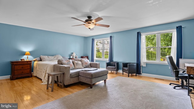 141 N Woodbine Ave, Langhorne, PA 19047 - bedroom featuring multiple windows, wood finished floors, a desk, and baseboards